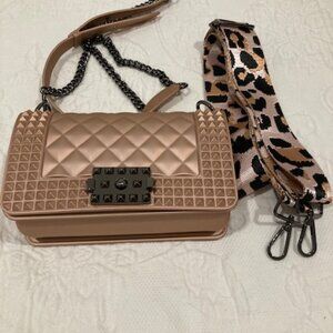 Rose gold purse with gunmetal accents